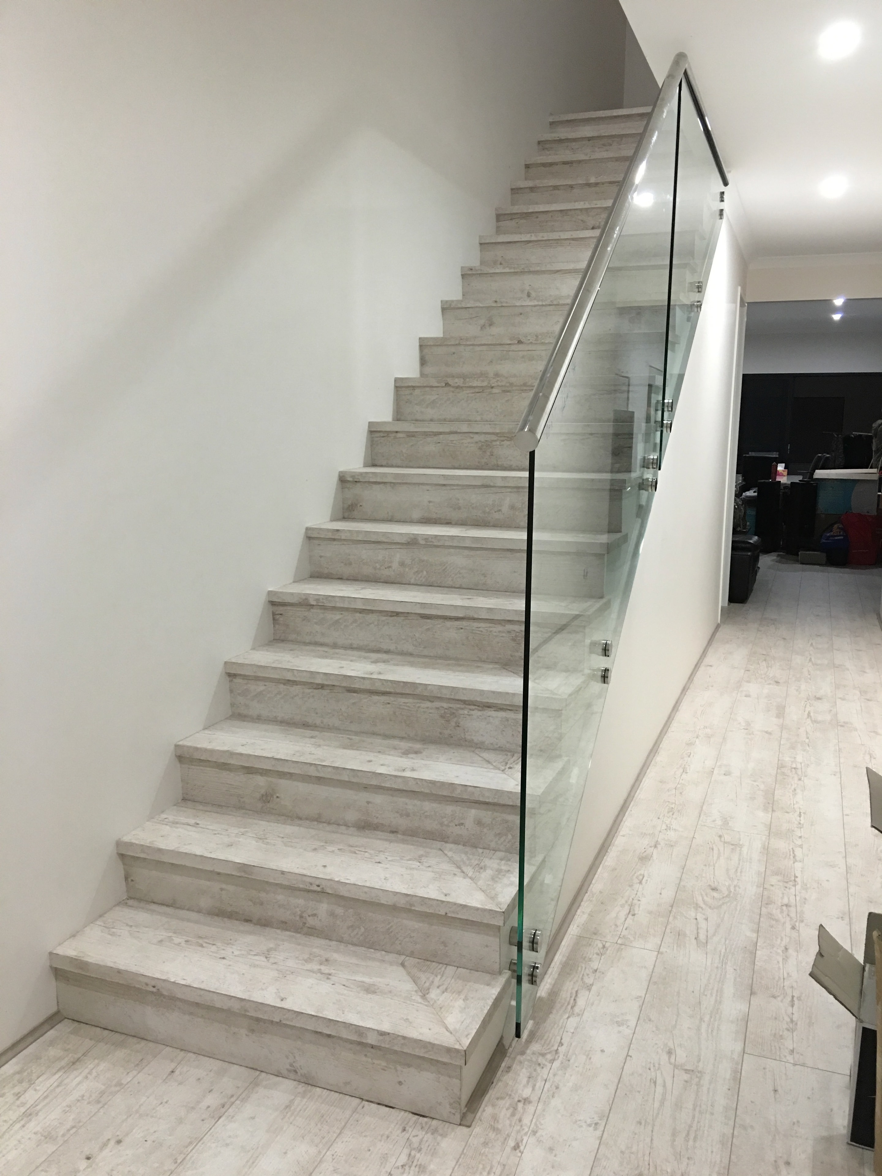 Modern concrete staircase with glass railing