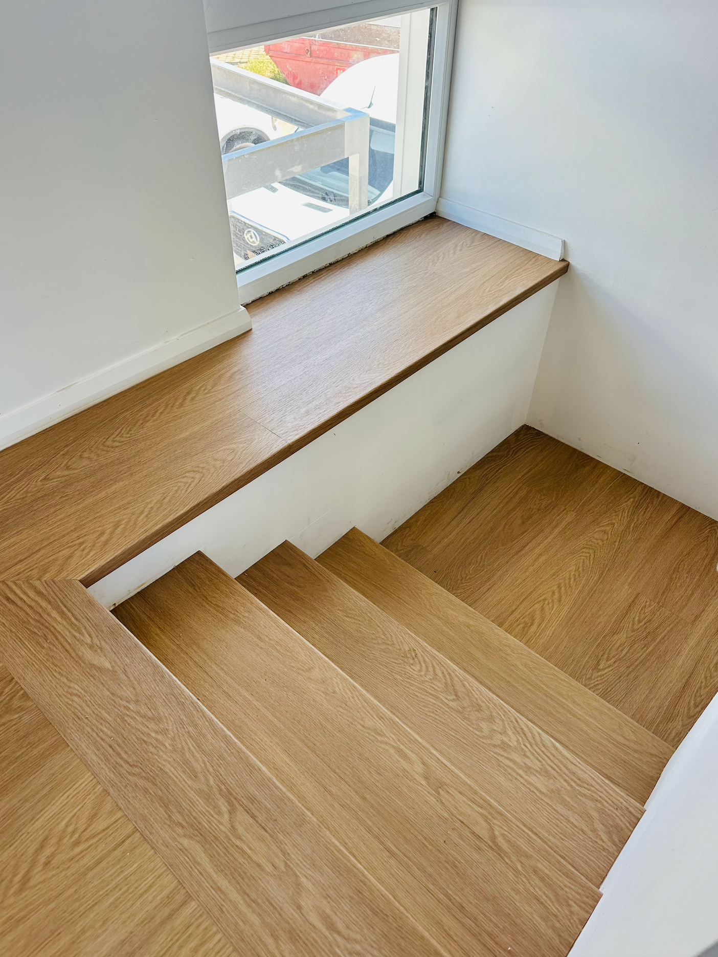 Wooden stairs leading to window sill