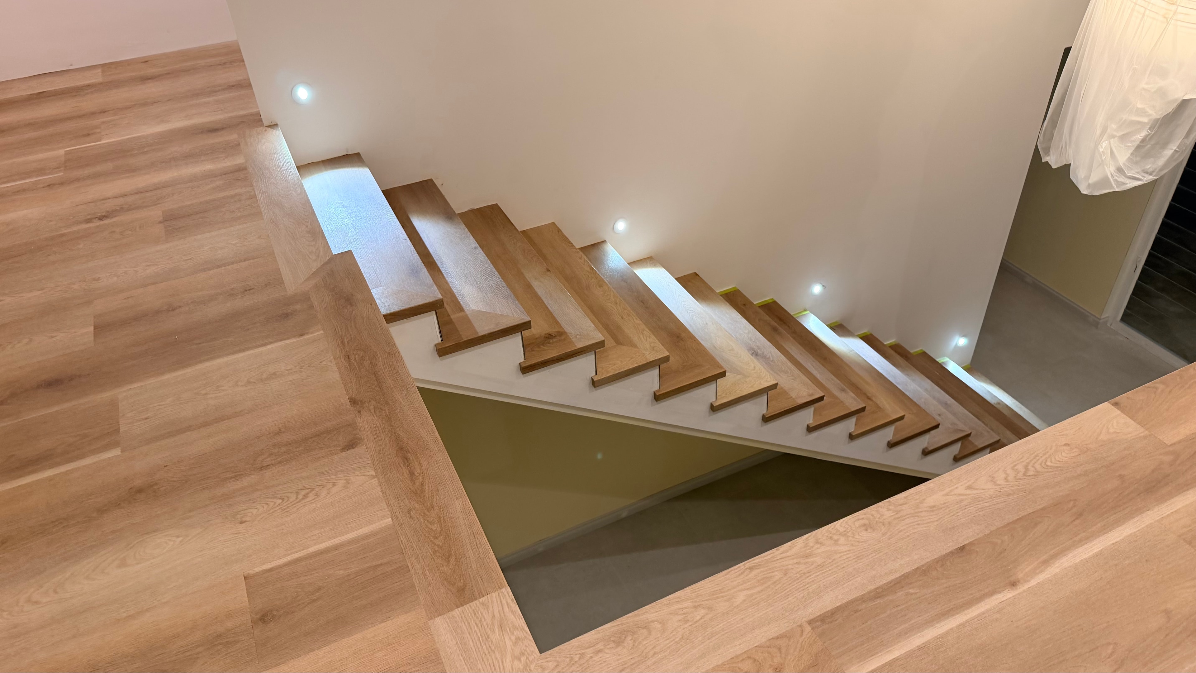 Timber staircase with recessed lighting